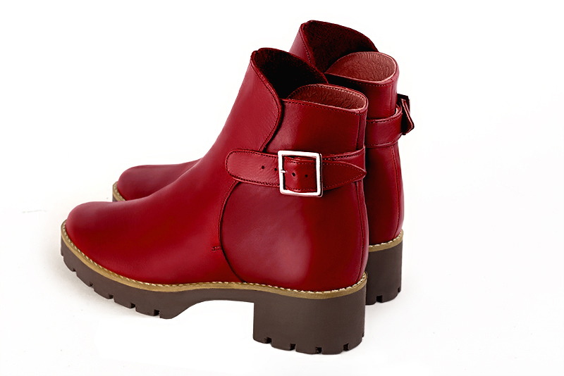 Cardinal red women's ankle boots with buckles at the back. Round toe. Low rubber soles. Rear view - Florence KOOIJMAN